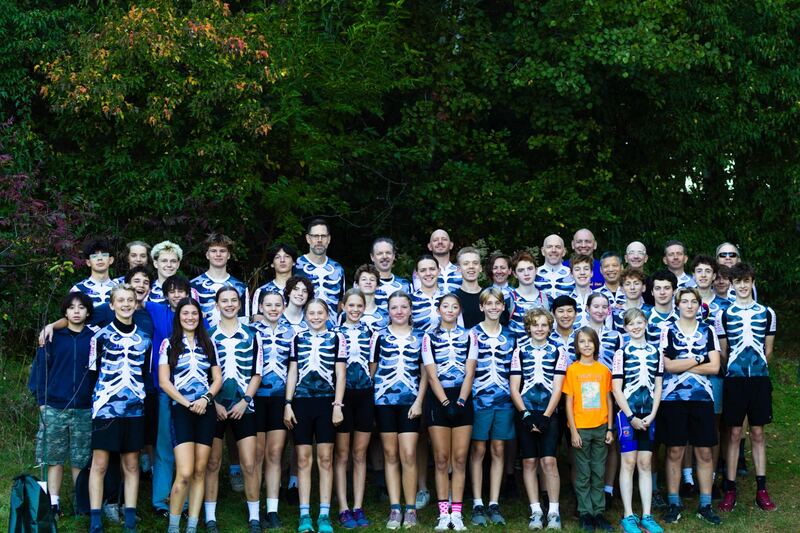 St. Paul Central Mountain Bike Team group photo - students and coaches in team jerseys